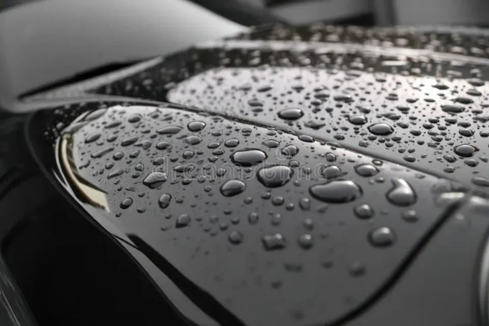 Close-up of ceramic coating water beads on a black car — hydrophobic paint protection by Skyline Custom Shop in Chantilly, VA